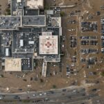 Aerial view of a hospital surrounded by floodwaters