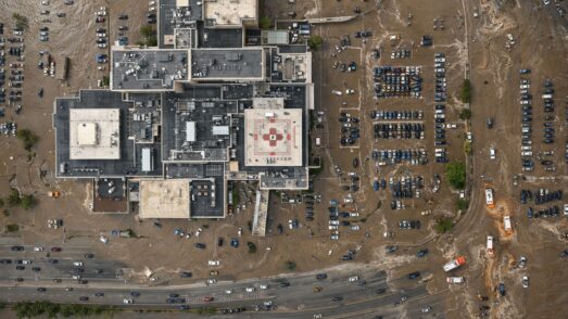 Aerial view of a hospital surrounded by floodwaters